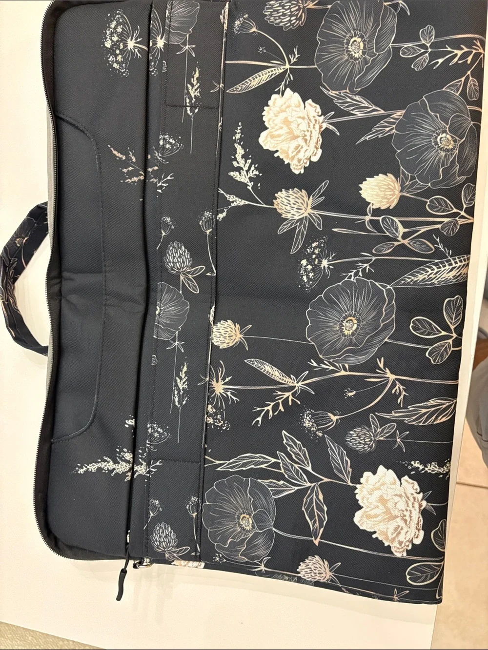 Mosiso brand Black Floral Laptop Bag with Cream Accents